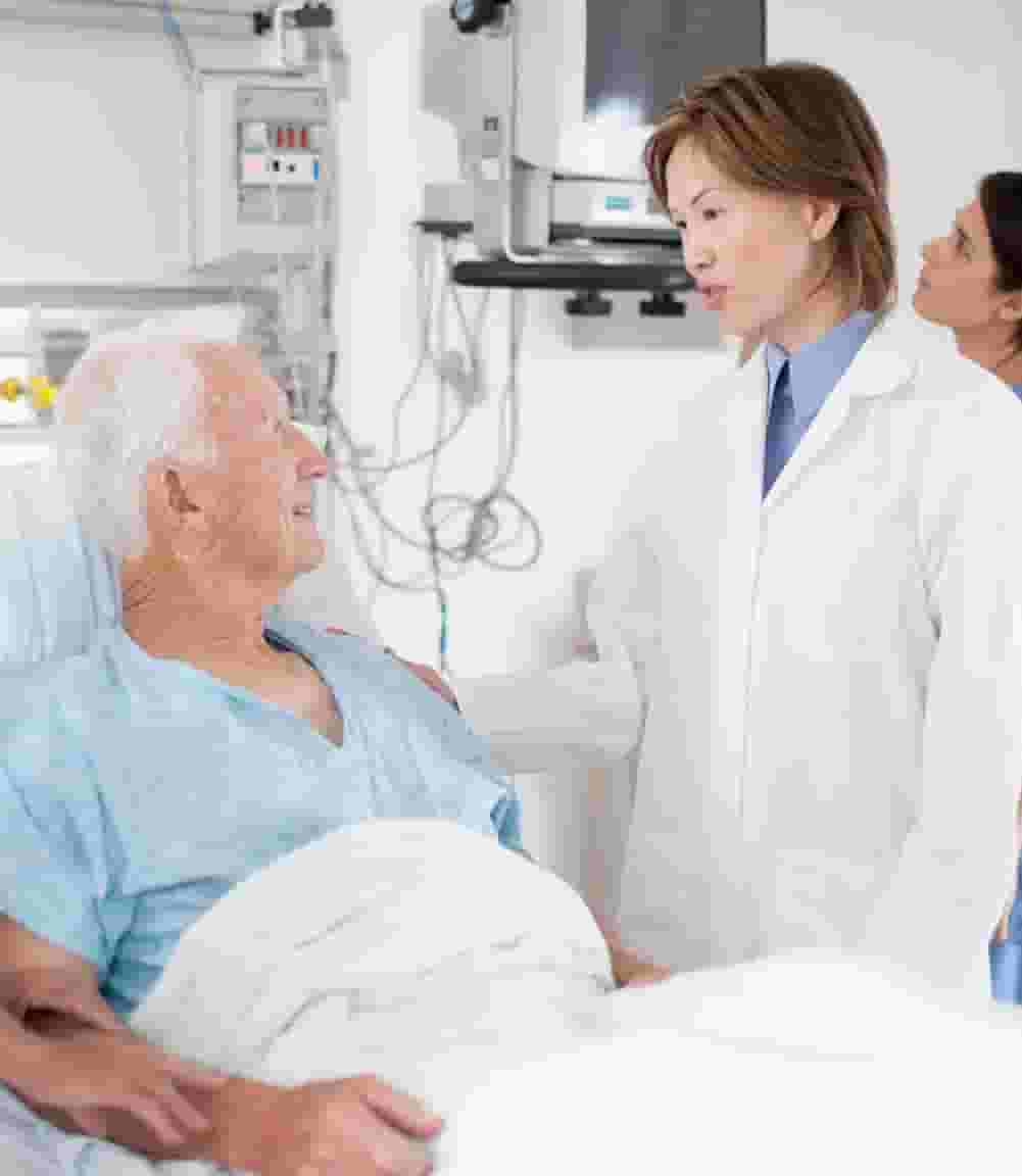 A group of doctors standing around in a room.