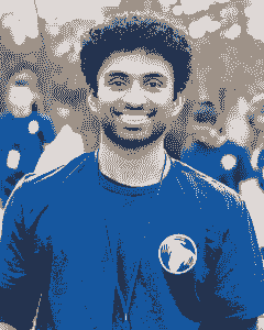 A man in blue shirt and white star on chest.