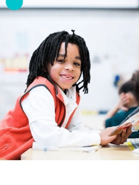 A closeup look at a kid smiling